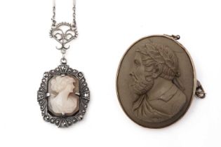 A carved lava cameo brooch, and a pendant on chain