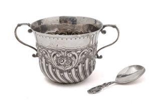 A silver porringer, by Josiah Williams & Co and a caddy spoon