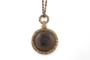 A Victorian gold locket on chain