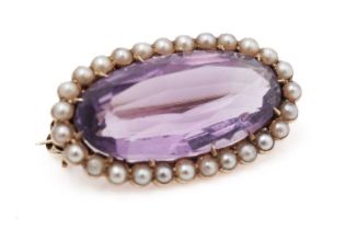 An Edwardian amethyst and seed pearl brooch