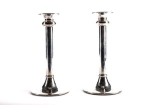 A pair of silver candlesticks, by L J Millington