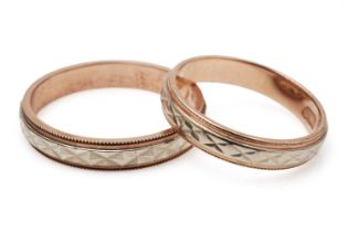 A pair of 14ct gold husband and wife wedding bands