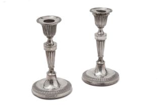 A silver pair of candlesticks, by Ollivant & Botsford