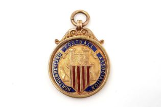 A 9ct yellow gold and enamel fob medal