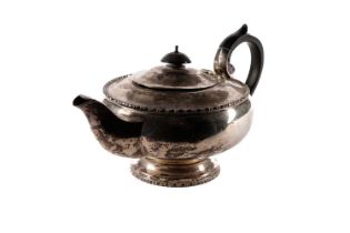 A silver teapot, by Walker & Hall