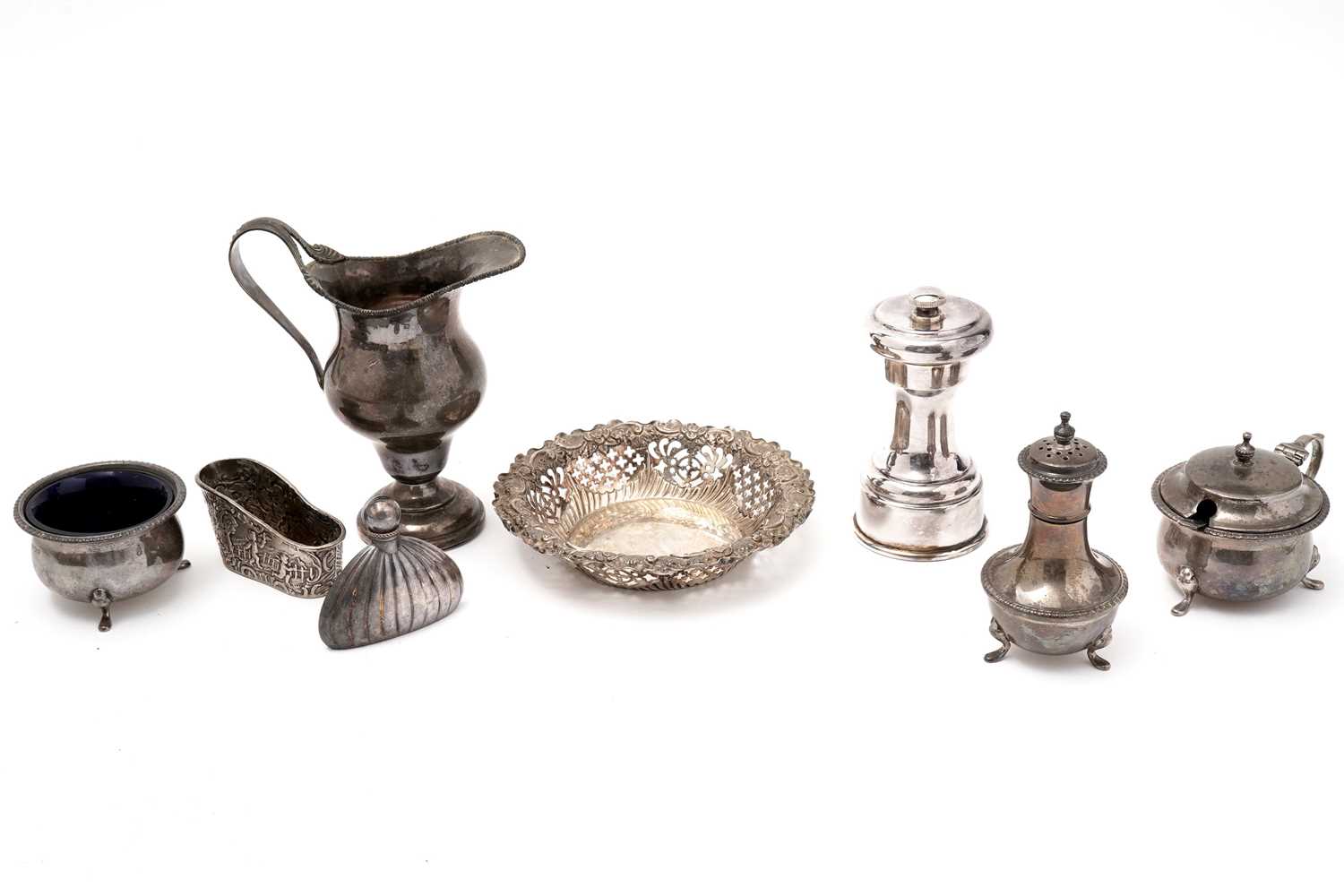 A selection of silver items and a plated pepper grinder