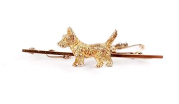 A yellow gold dog motif bar brooch
