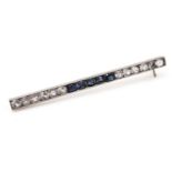 A white sapphire and sapphire bar brooch