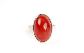 A coral and yellow gold dress ring