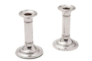 A pair of silver candlesticks