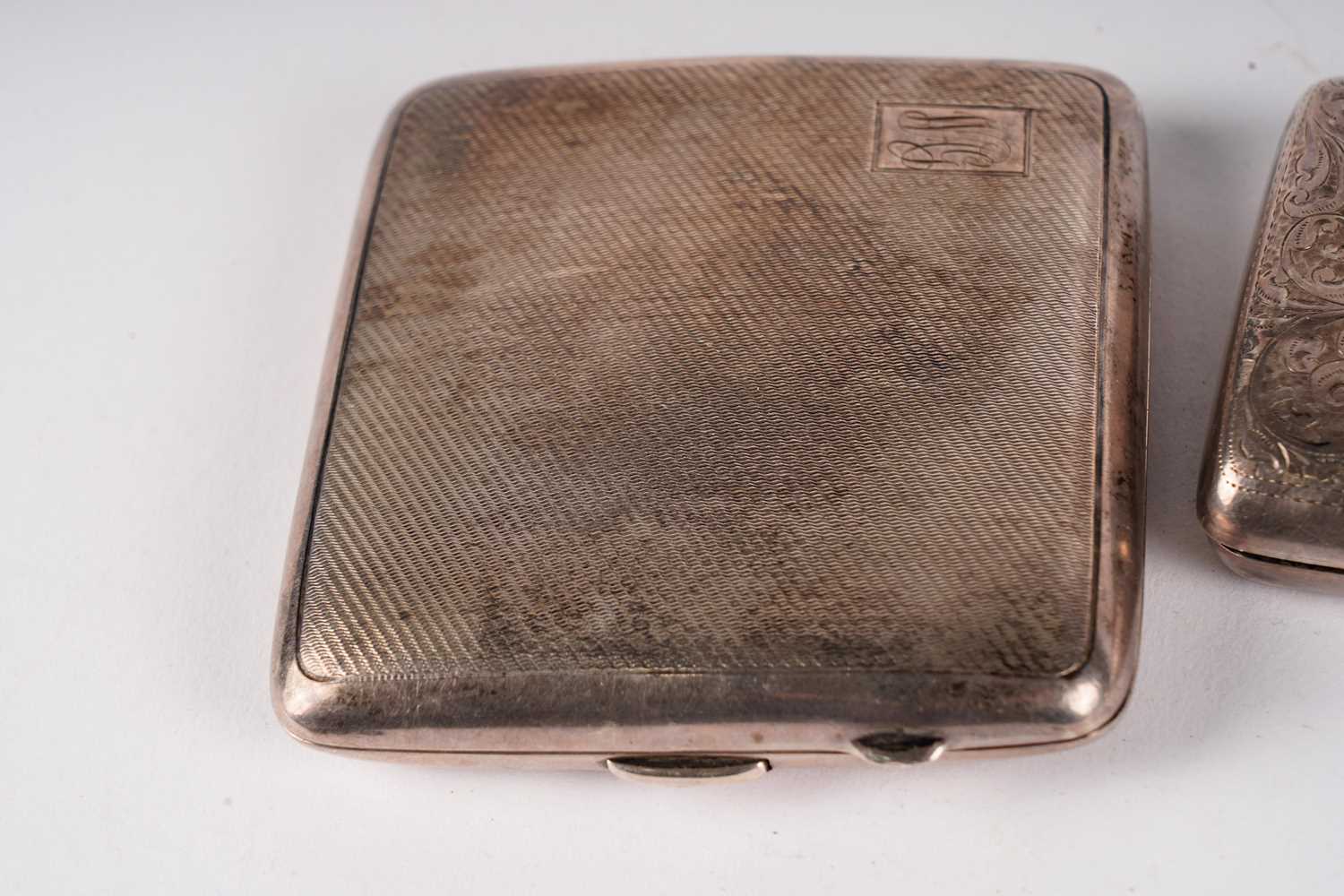 Two silver cigarette cases; an enamelled cigarette case; and a vesta case - Image 4 of 5