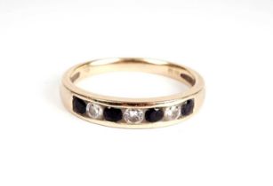 A sapphire and diamond half-hoop eternity ring