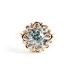 A blue zircon and diamond cluster dress ring