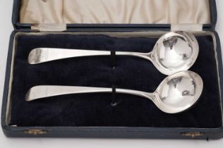 A pair of George III silver sauce ladles