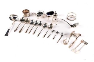 A collection of silver cutlery and condiments