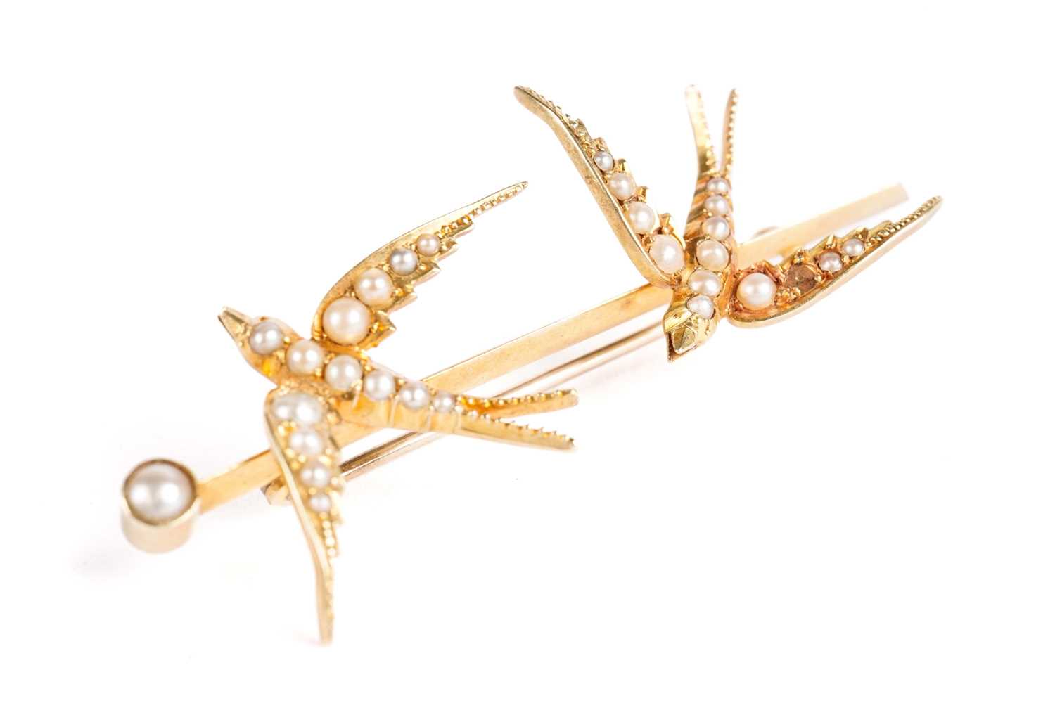 A seed pearl and yellow gold bar brooch