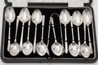 A set of twelve silver teaspoons and a pair of sugar tongs