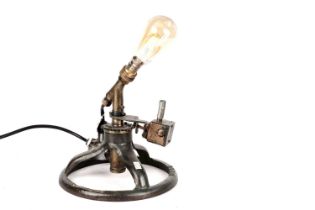 A 1930s garden sprinkler upcycled to a table lamp