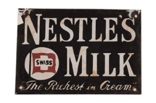 A Nestles enamel advertising sign