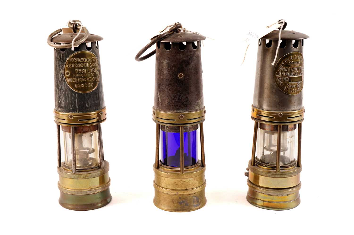 Three miners safety lamps