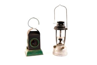 A Vintage paraffin lamp; and another