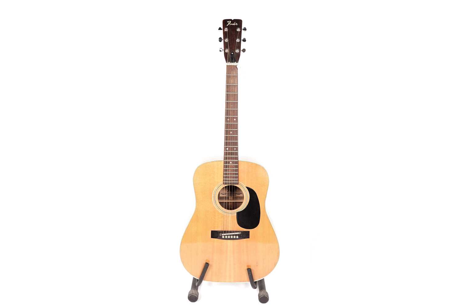 A Fender F-65 acoustic guitar