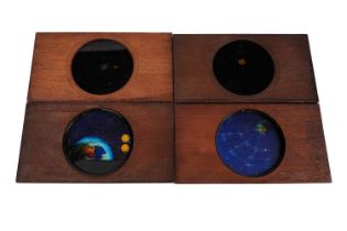 A collection of four polychrome Carpenter and Westley magic lantern slides