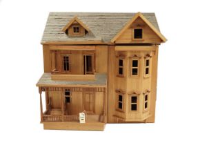 A child's three-storey stained wood dolls house