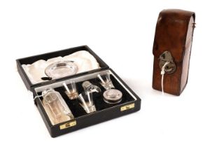 A Victorian leather cased glass hunting flask; and a travelling Holy Communion set