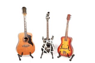 Two acoustic guitars and an electric