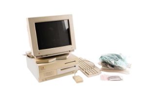An Apple Macintosh computer, monitor and accessories