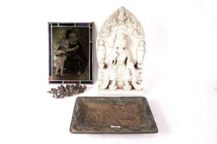 A mid-Century Belgian stained glass panel and a collection of decorative Asian sculptures