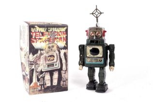 A tinplate battery powered television spaceman robot