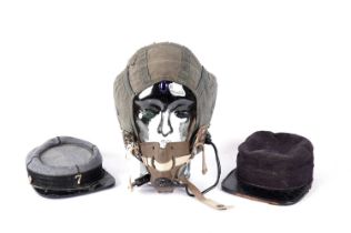 A British RAF helmet and two kepis