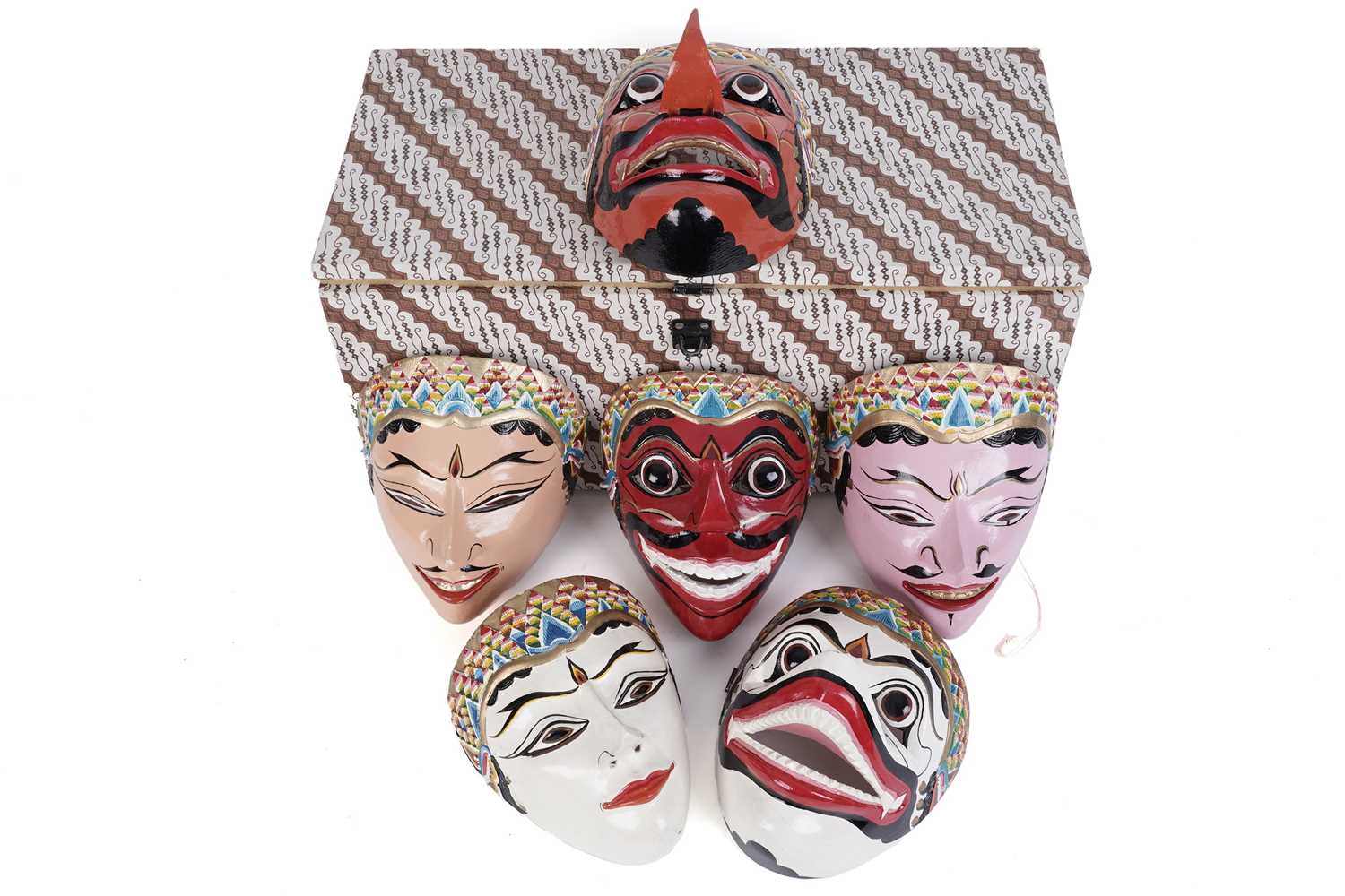 A collection of vintage hand painted Indonesian Barong masks