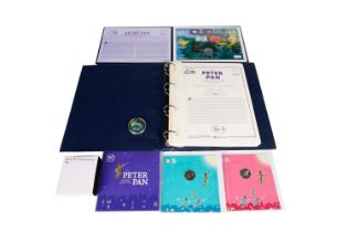 A collection of Peter Pan, and other coins