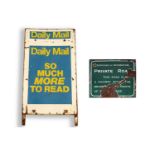 A street name enamel road sign and a Daily Mail advertising sign
