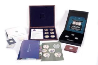 A collection of QEII gold-plated cupro-nickel presentation coin sets