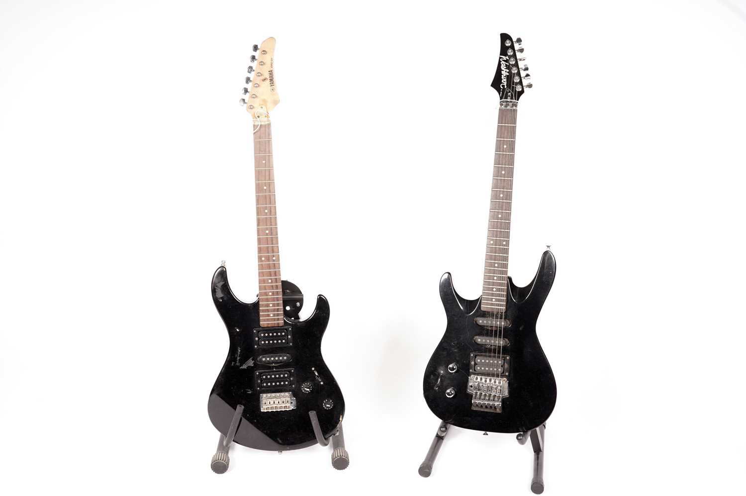 Two black electric guitars