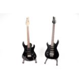 Two black electric guitars