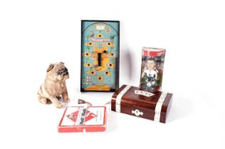 A collection of vintage toys including Monopoly, Treasure Hunt bagatelle, and others