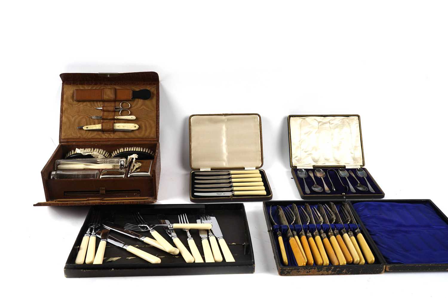 A vintage leather vanity box; and a selection of silver plated and stainless steel cutlery