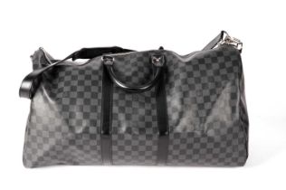 A Louis Vuitton Damier Keepall in black and graphite