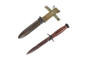 A US M3 fighting knife and scabbard