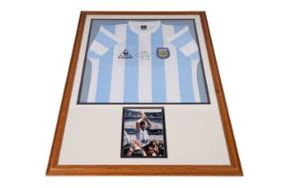 An Argentina World Cup replica football shirt signed by Maradona