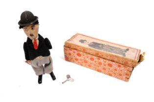 Schuco: A 1920s Charlie Chaplin wind up tinplate clockwork toy