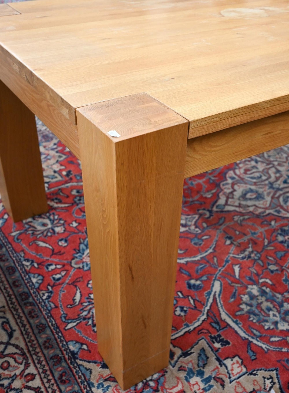 A large contemporary light oak corner-leg dining table, rectangular top with square supports ( - Image 2 of 5