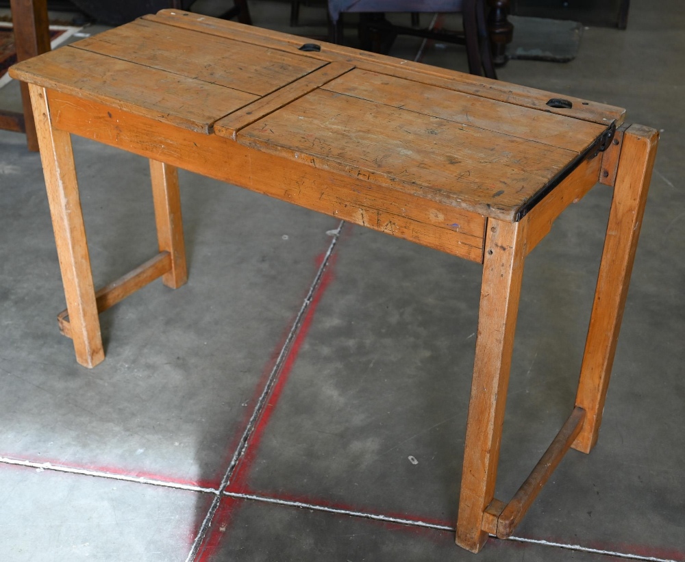 A vintage beech double school desk with twin-hinged panelled top, 108 cm wide x 40 cm deep x 66 cm - Image 2 of 4