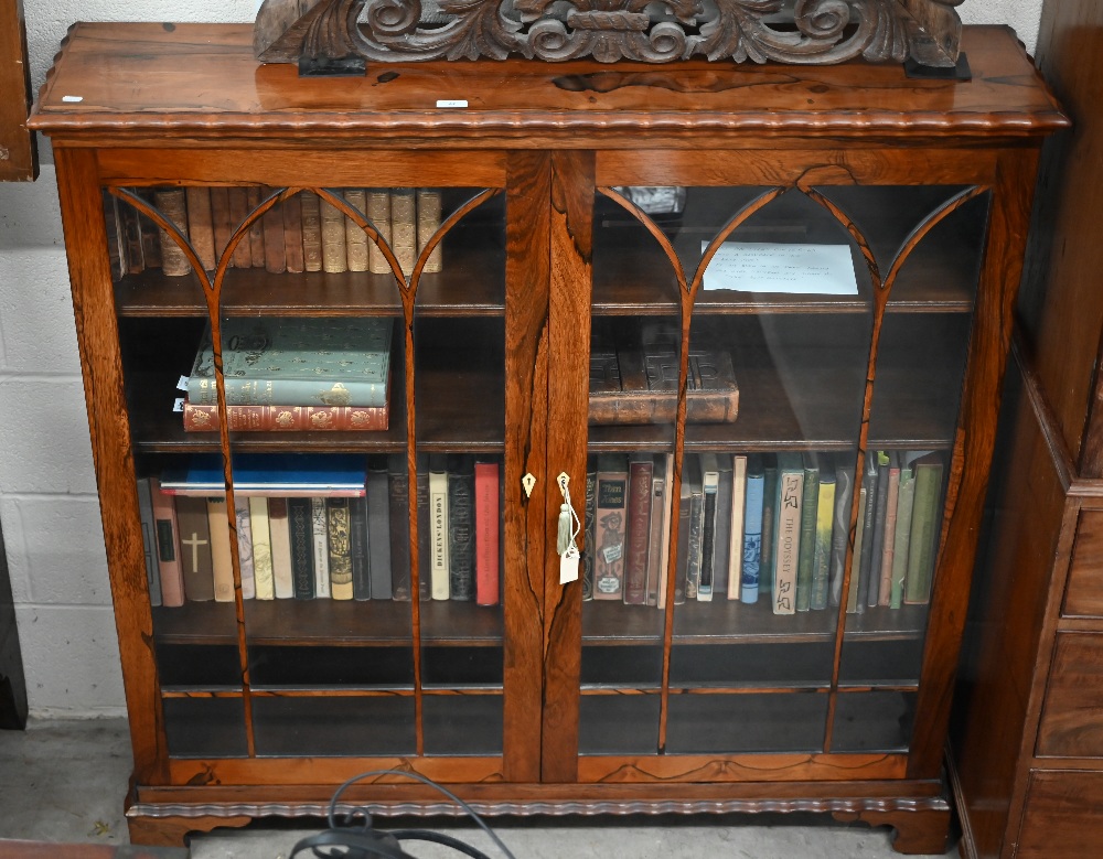 A Victorian rosewood 'piano bookcase' the pair of glazed doors enclosing three shelves standing on - Image 2 of 2