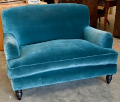 A Howard stye love seat in peacock blue velour fabric, ebonised turned front supports, 140 x 100 x